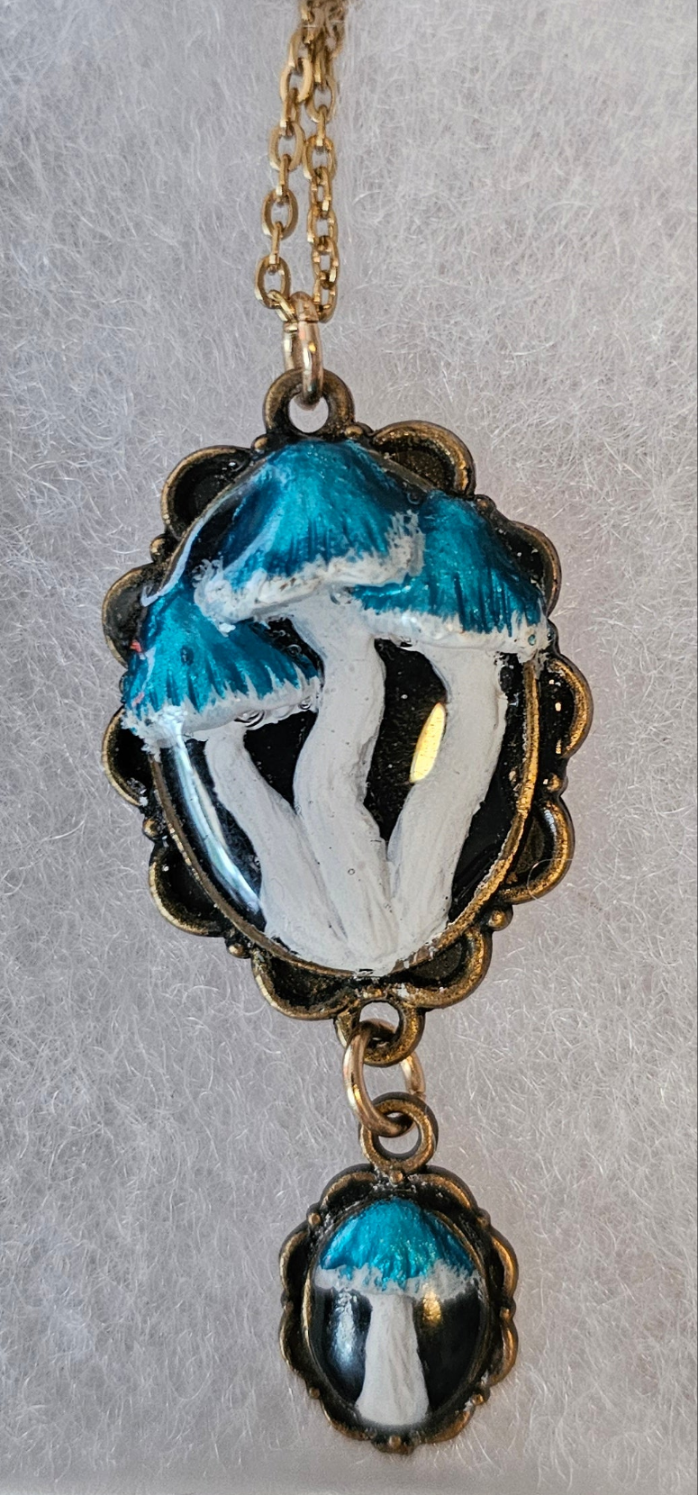 Double Stainless steel Pendant with handcrafted mushrooms, sealed in UV Resin for porcelain look.